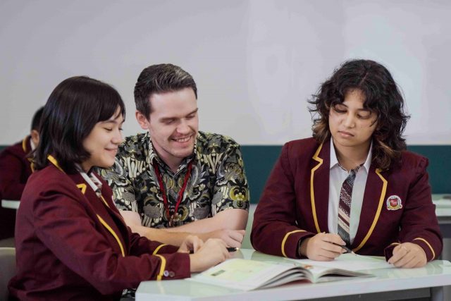 IBCP students discuss with the teacher