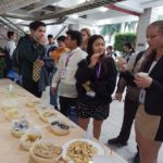 Delegates enjoy Indonesian snacks with delight.                    